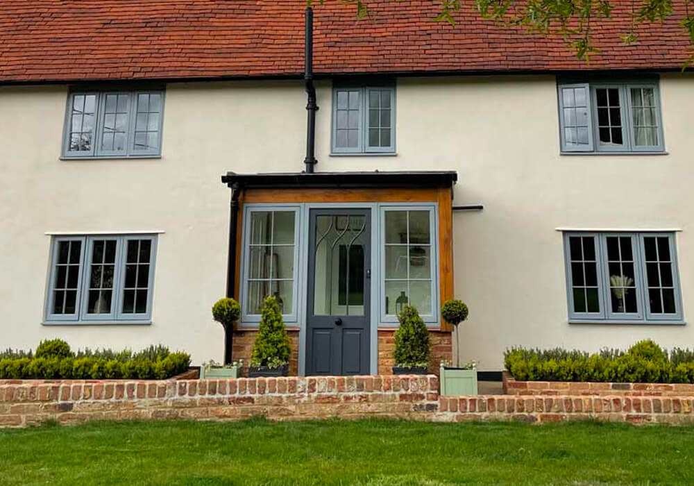 Grey sliding sash windows and entrance door