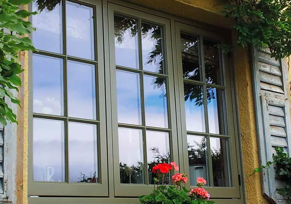 Close up of a green timber casement window