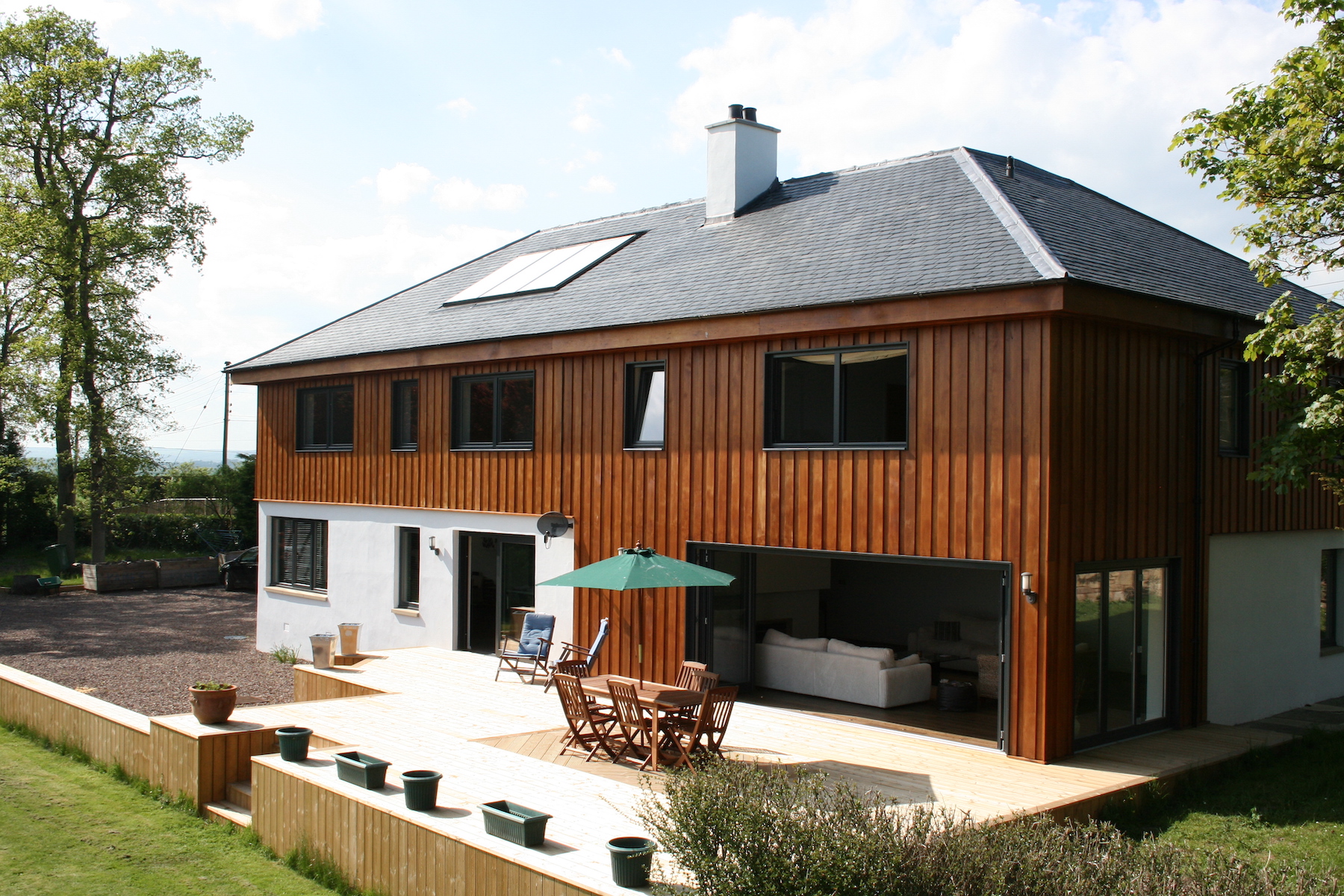 Garden view of a house with bi-fold doors