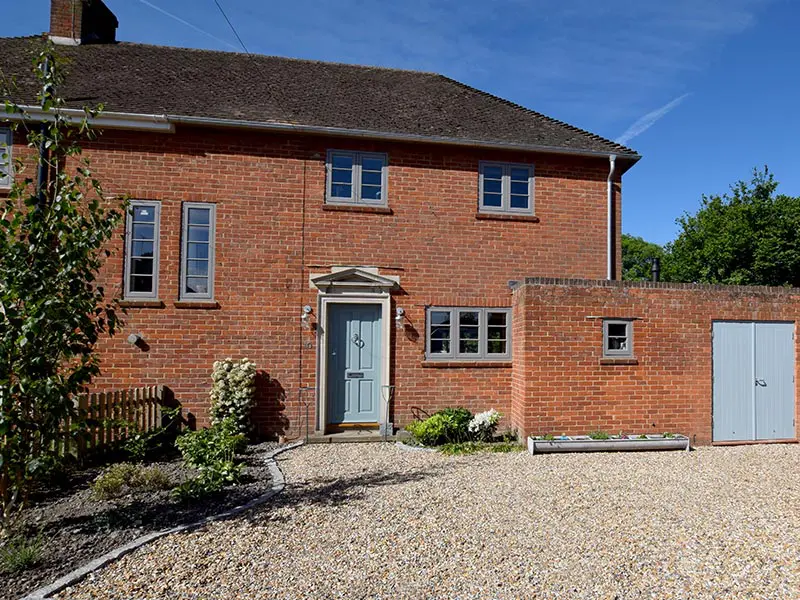 casement windows and blue front door