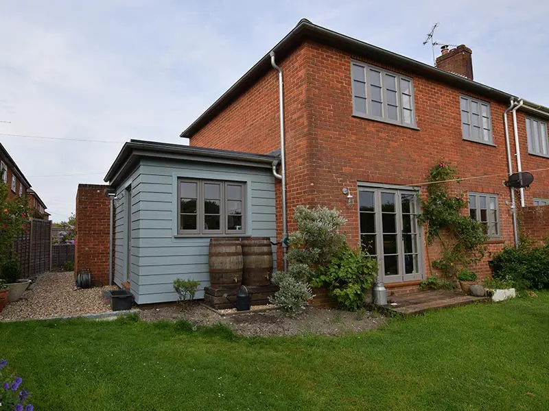 House with timber flush casement windows