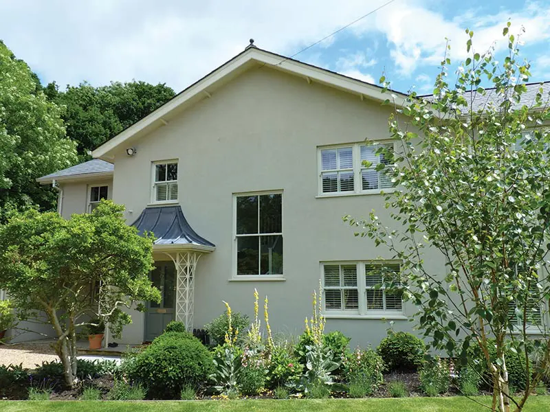 Large white house with sliding sash windows