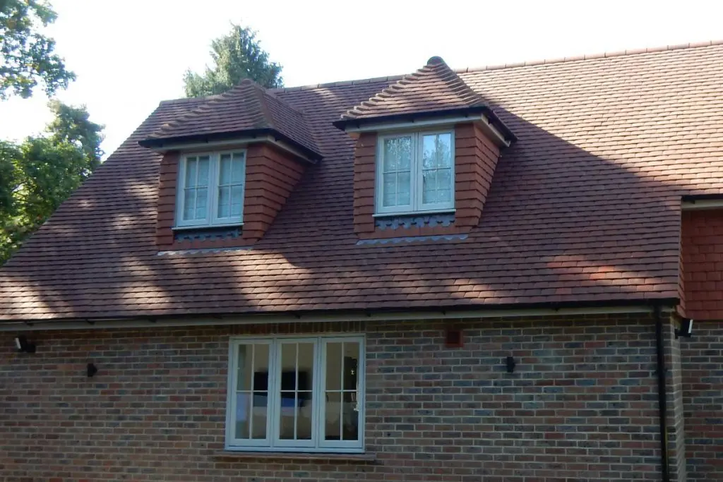 Traditional house with white timber flush casement windows