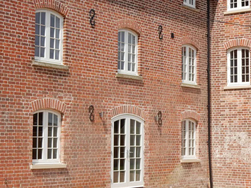 Traditional white flush windows and French doors