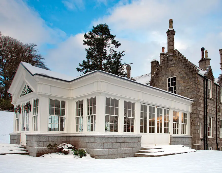 Outside view of a snowy conservatory