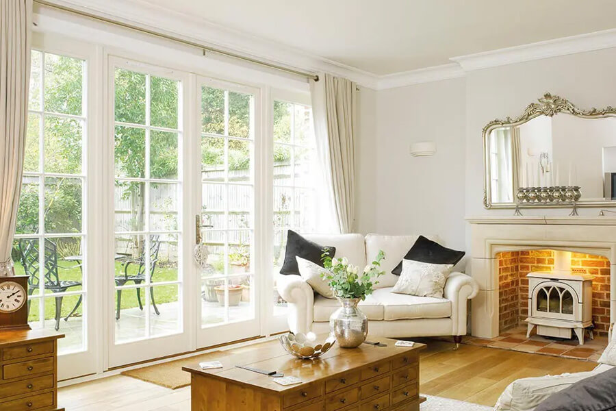 Living area with white timber French doors