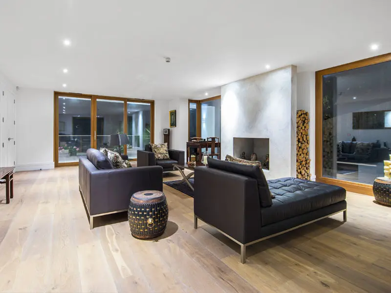 Living area with timber effect bifold doors