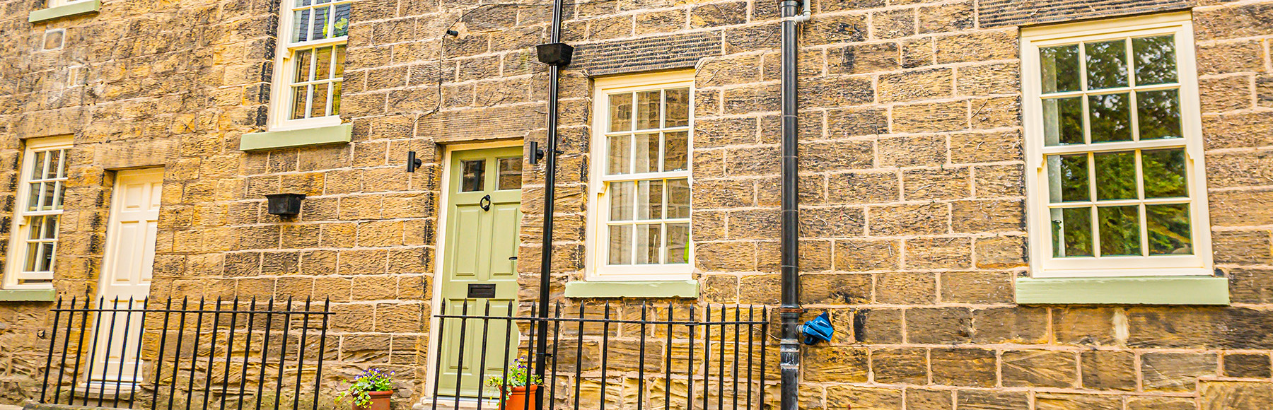 Cottage with sliding sash windows