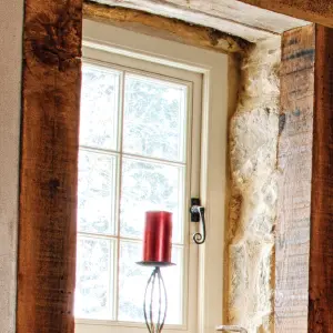 Close up of a window showcasing traditional bars