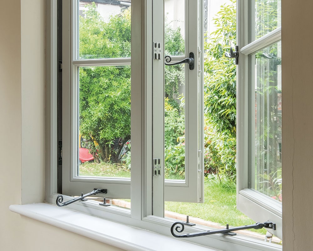 Green traditional flush casement windows monkey tail handle